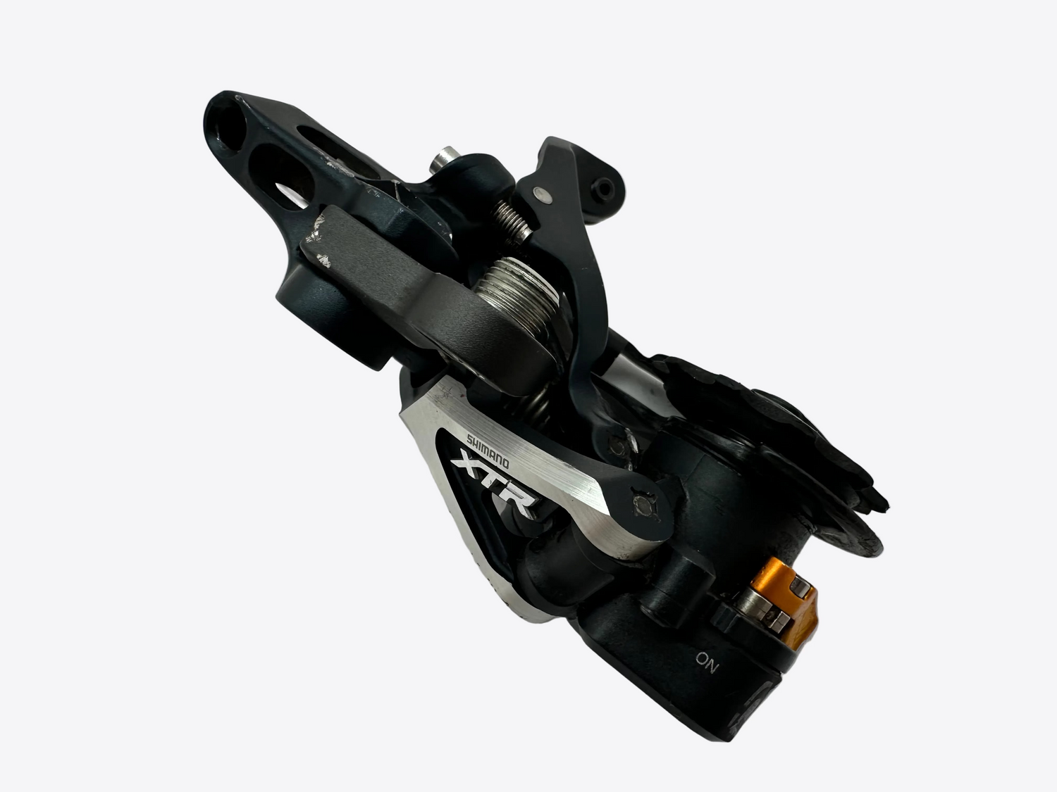 Bicycle derailleur with 'XTR' branding on a white background