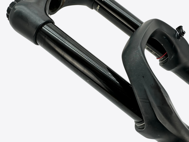 Close-up of a black bicycle fork on a white background