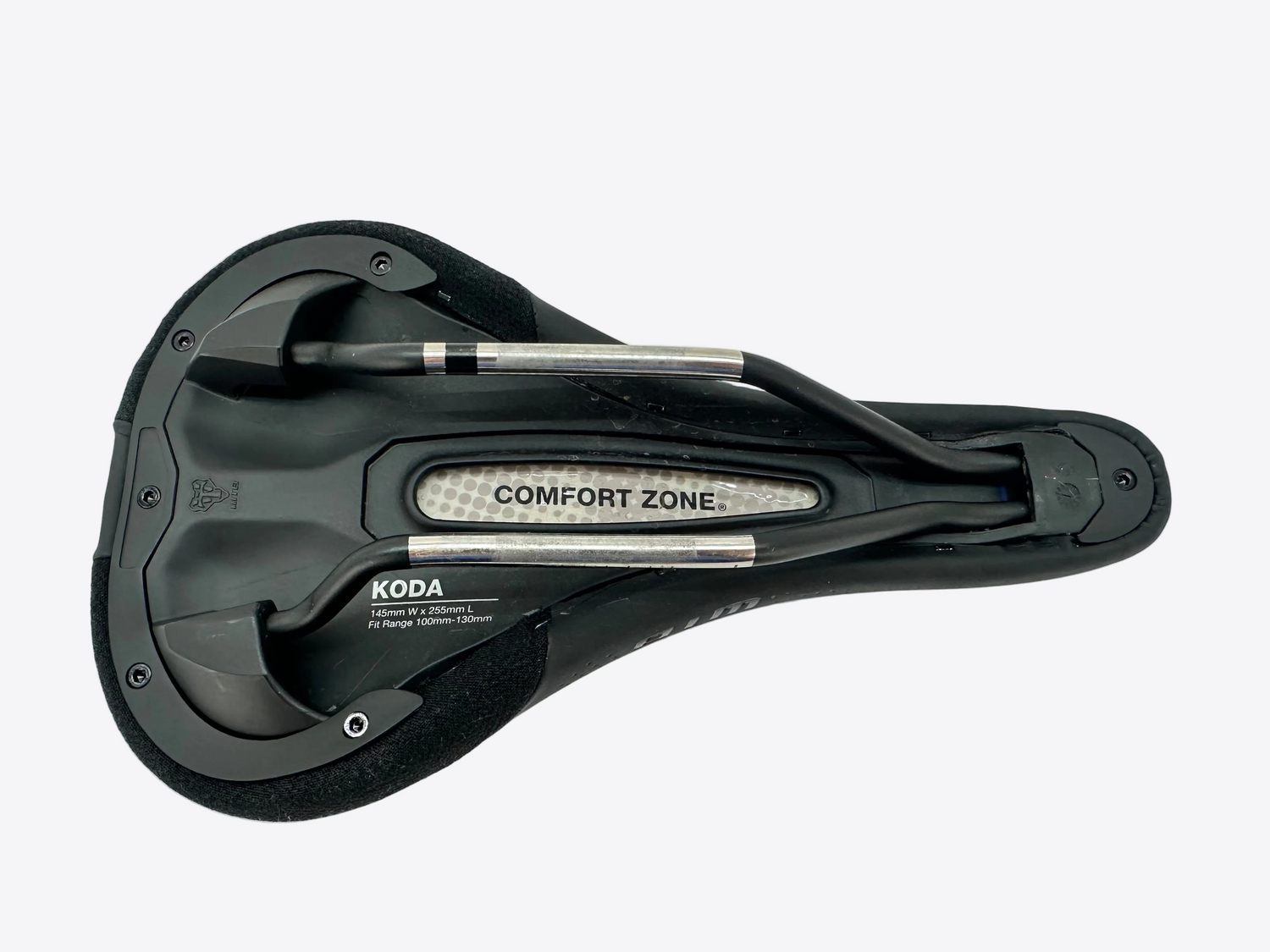 A black Koda Comfort Zone bicycle saddle shown from a top-down view on a light gray surface.