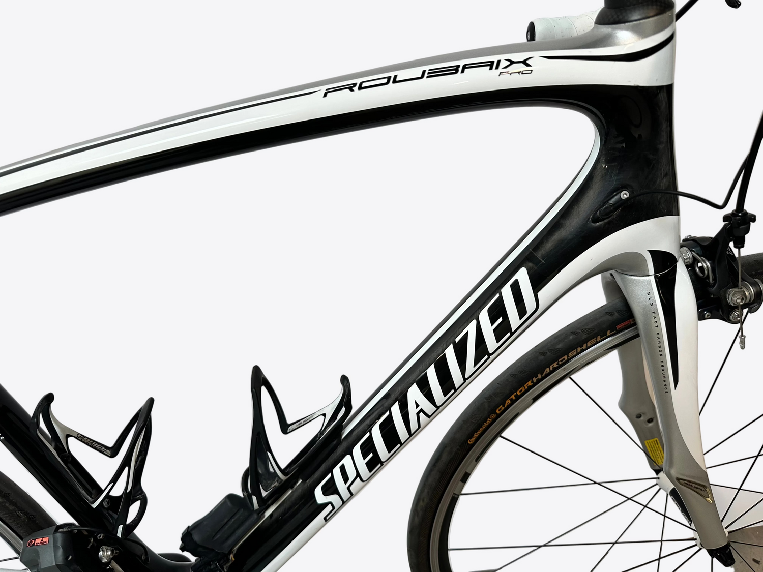 Close-up of a bicycle frame with 'Specialized' branding on a white background
