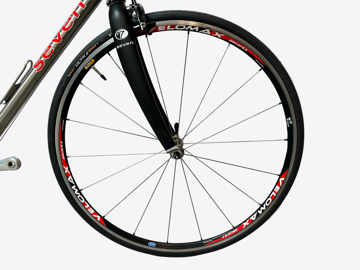 Bicycle wheel on a textured white wall background
