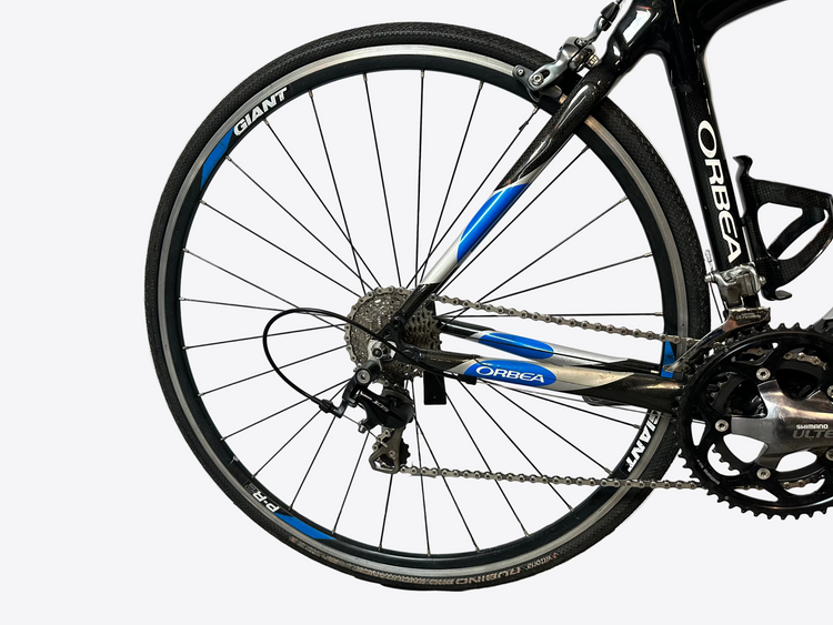 Close-up of a bicycle wheel with visible branding on a white background