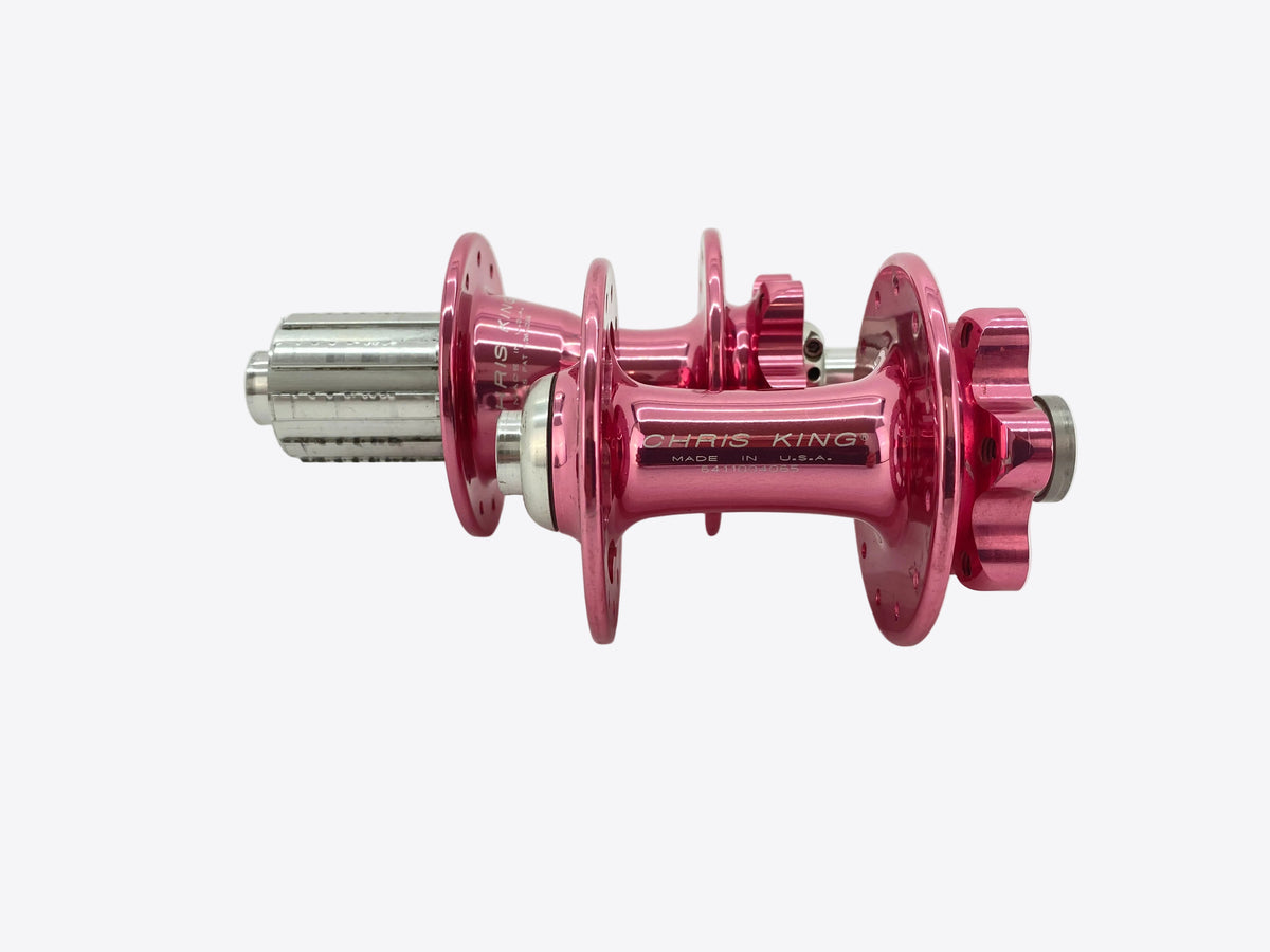 a pair of pink chris king hubs