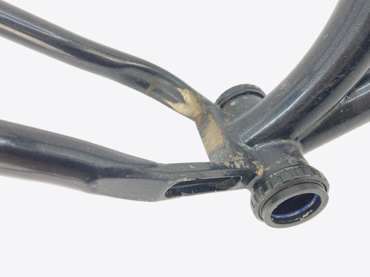 some dirt, worn off paint and rust at the chain stay yoke