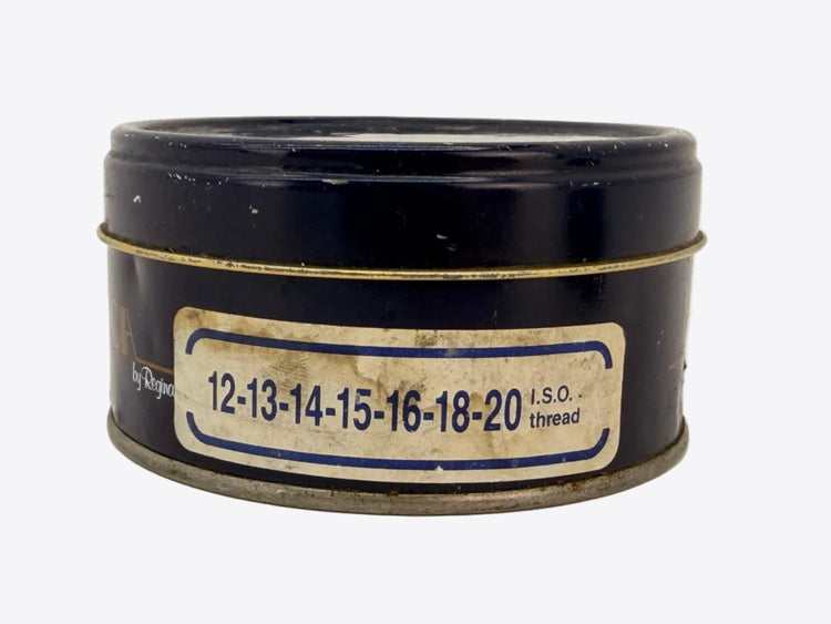 A vintage dark blue metal thread container with a worn paper label reading '12-13-14-15-16-18-20 I.S.O. thread'.