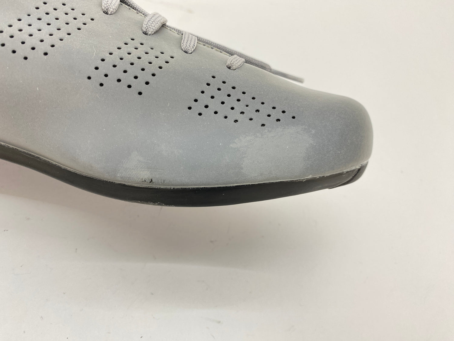 scuffs on the left shoe