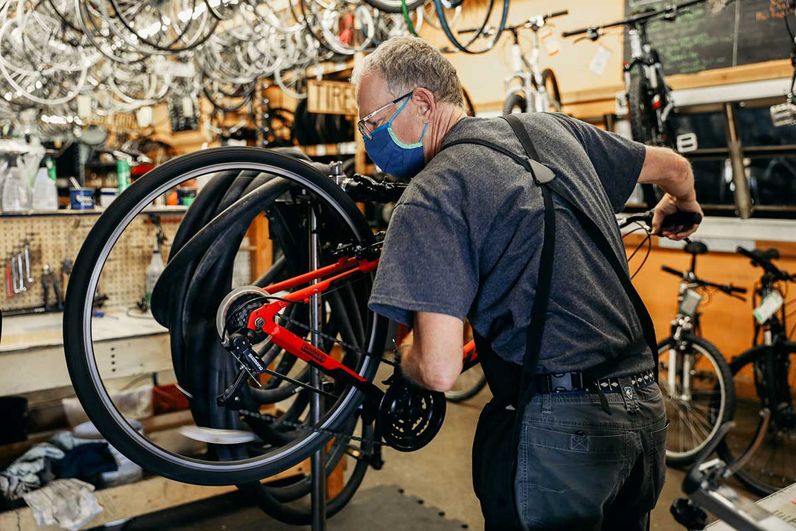 A mechanic tuning a bike at the Bicycle Collective.